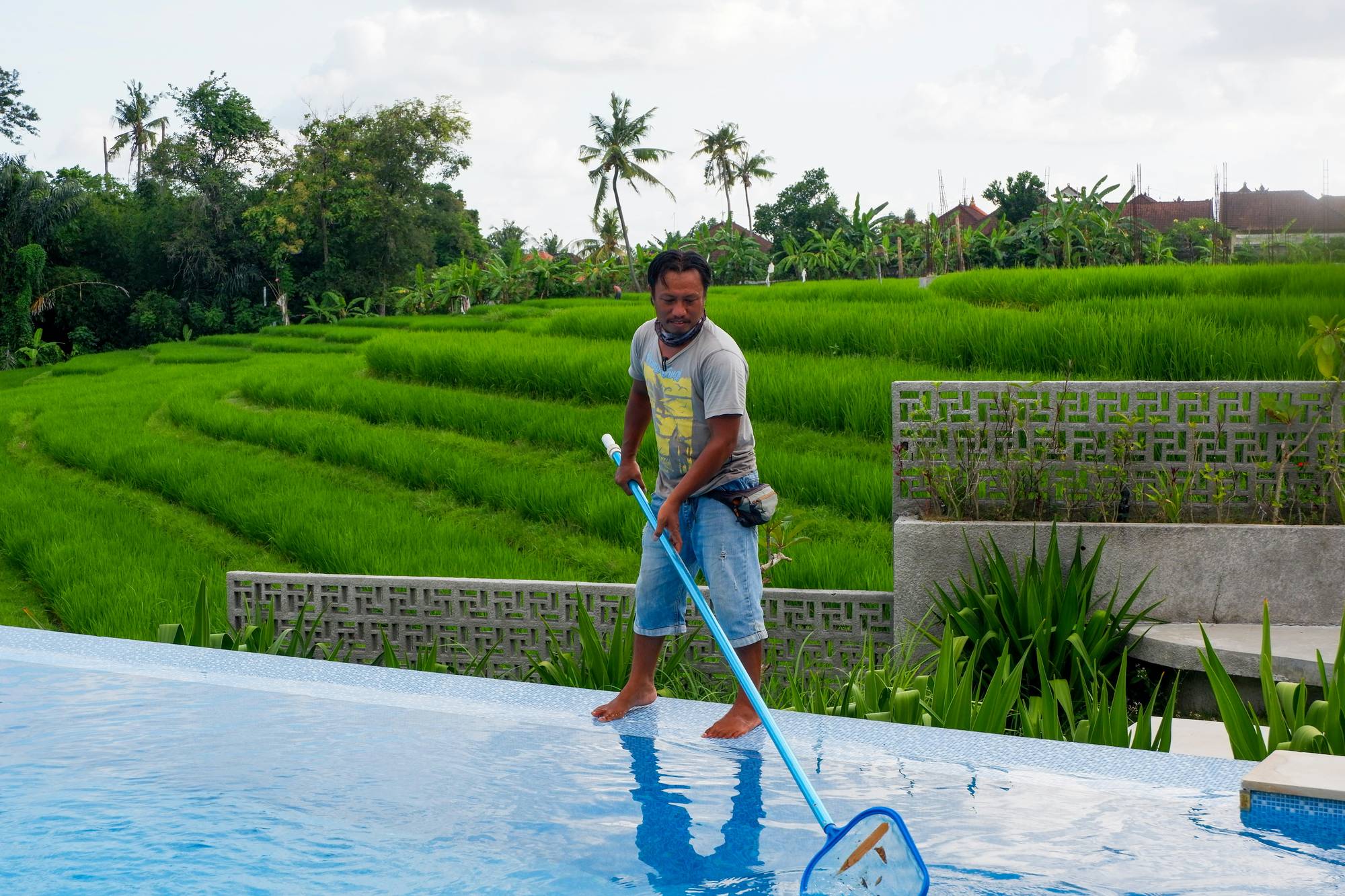 A pool service professional ready for the day's route
